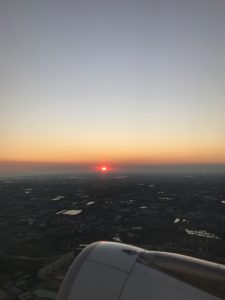 sunset outside plane window in Thailand