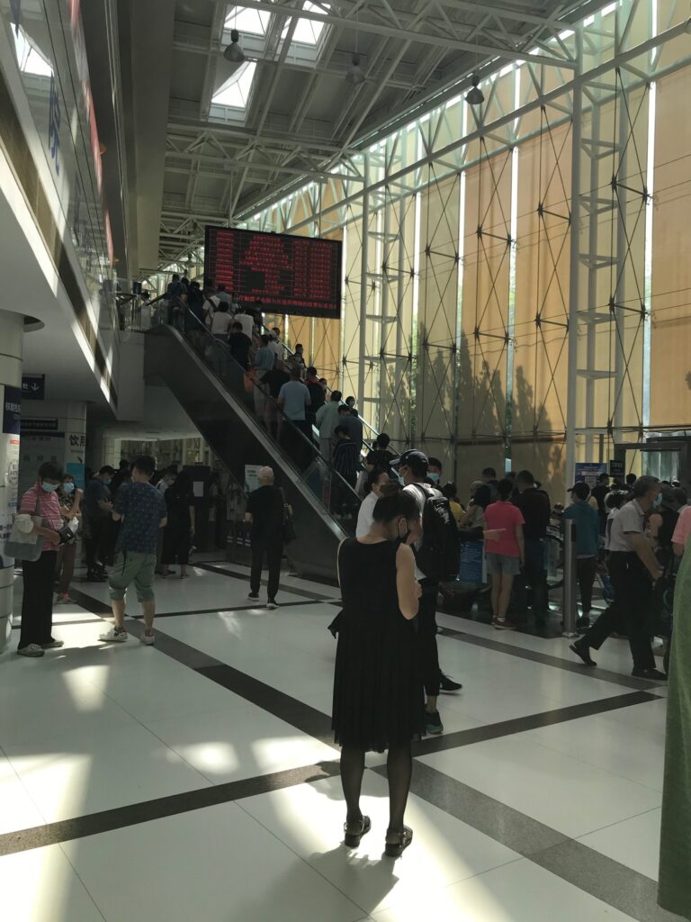 The crowd on an escalator in a public hospital in China. onaroadtonowhere.com
