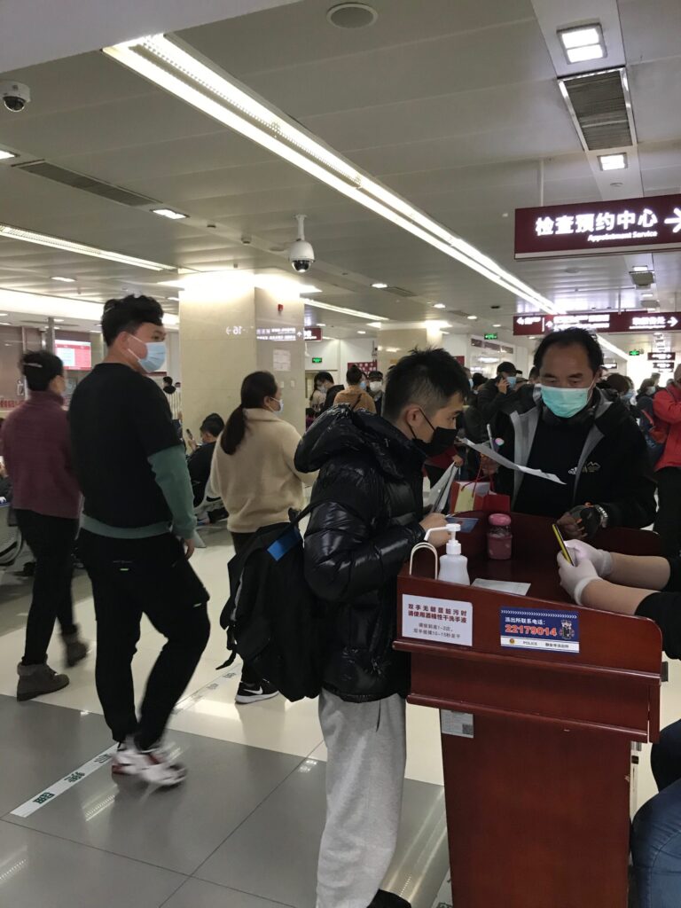 People waiting to register at a Chinese public hospital. onaroadtonowhere.com