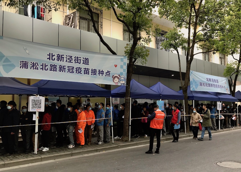 People wait in line for the vaccine in China - onaroadtonowhere.com