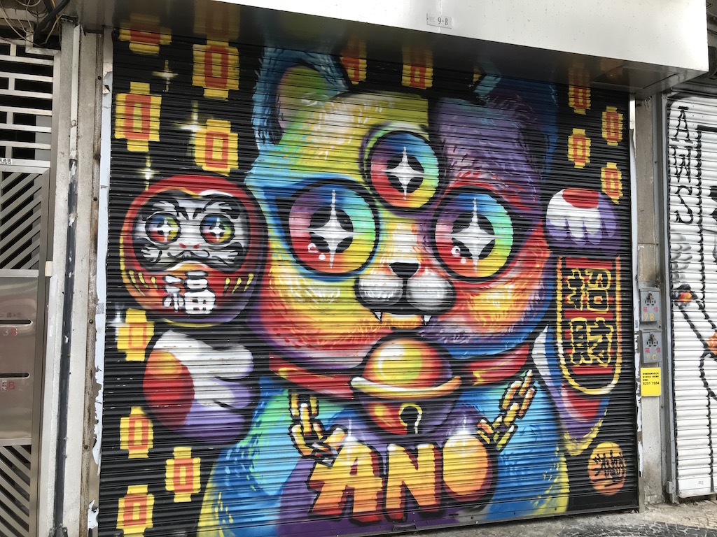 fortune cat graffiti - how to save money for travel a working class guide - onaroadtonowhere.com