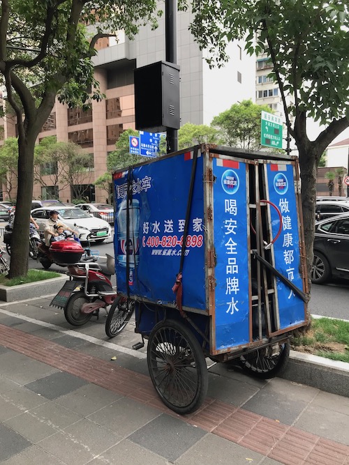 A water delivery bicycle in Shanghai, China.  Is the water in China safe? onaroadtonowhere.com
