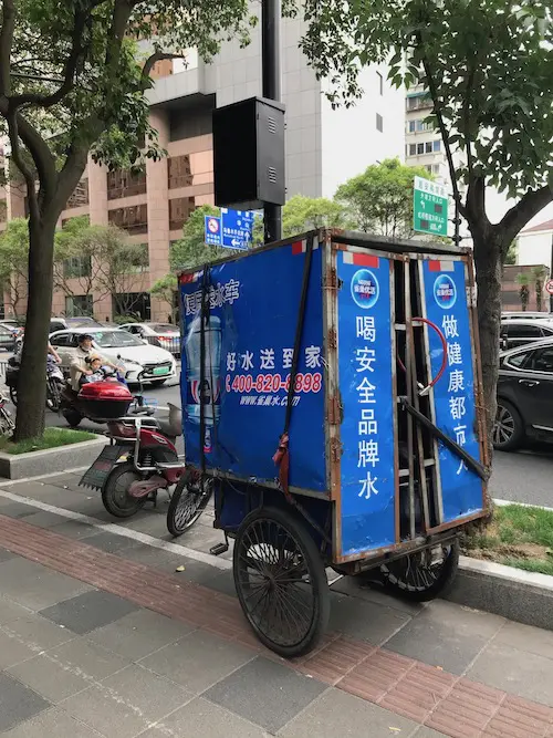 A water delivery bicycle in Shanghai, China. Is the water in China safe? onaroadtonowhere.com