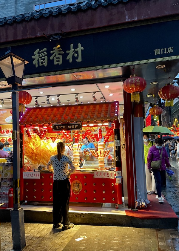 a candy seller in Beijing, China - onaroadtonowhere.com