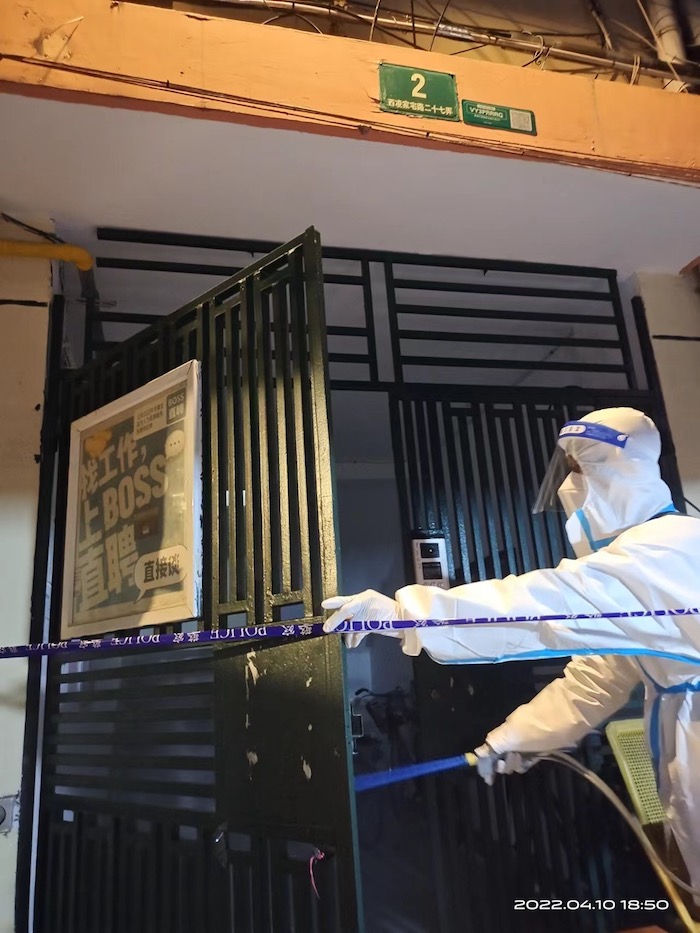 A worker disinfects a building during Shanghai lockdown onaroadtonowhere.com