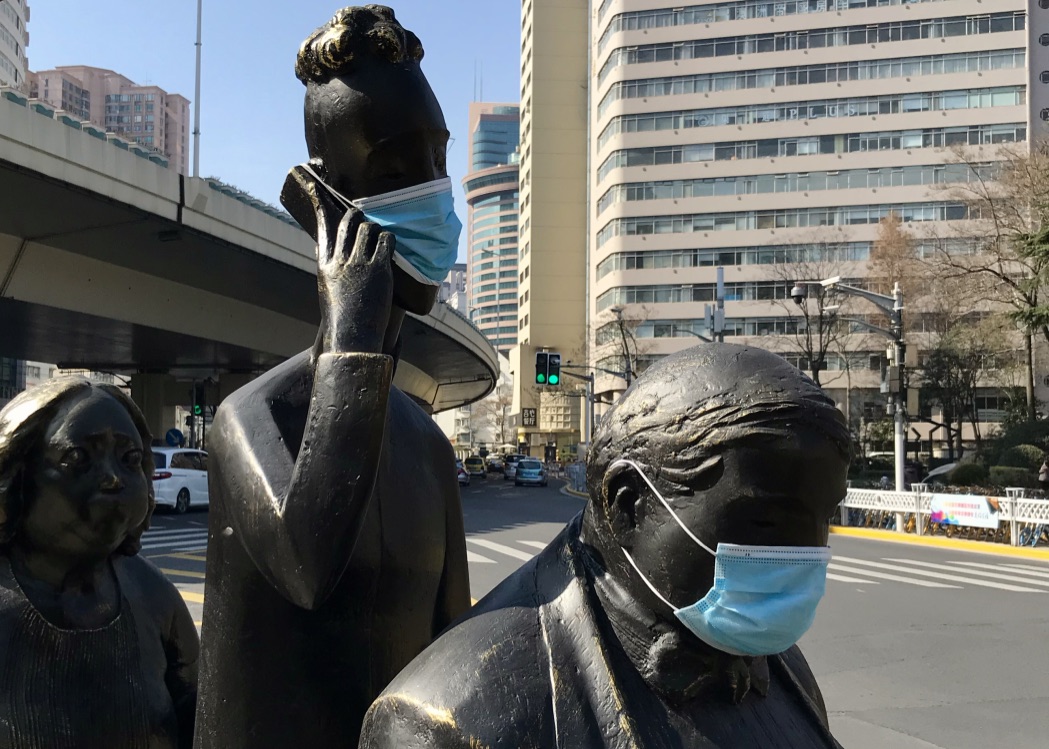 Statues wearing surgical masks in Shanghai, China during COVID-19
