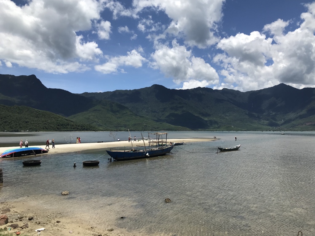 A shallow lake with boats in Vietnam