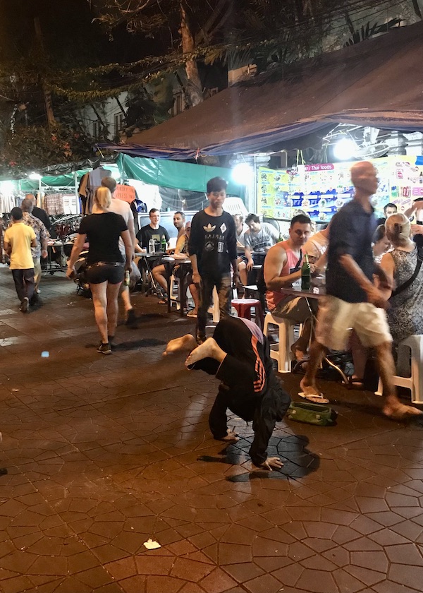 A young break dancer on the street in Bangkok, Thailand. onaroadtonowhere.com