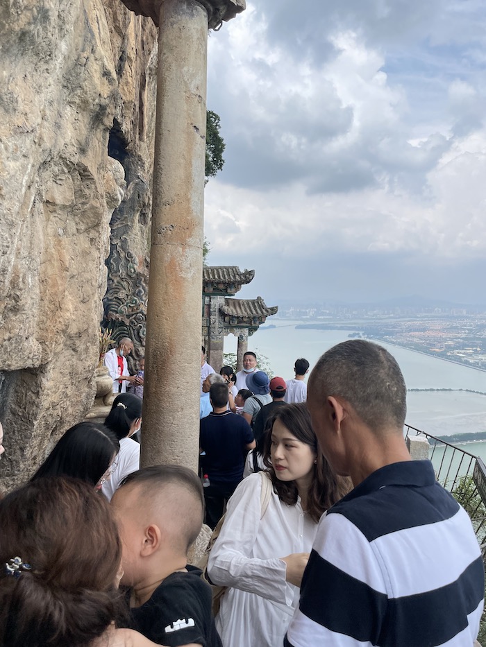 A crowd at the Dragon Gate onaroadtonowhere.com