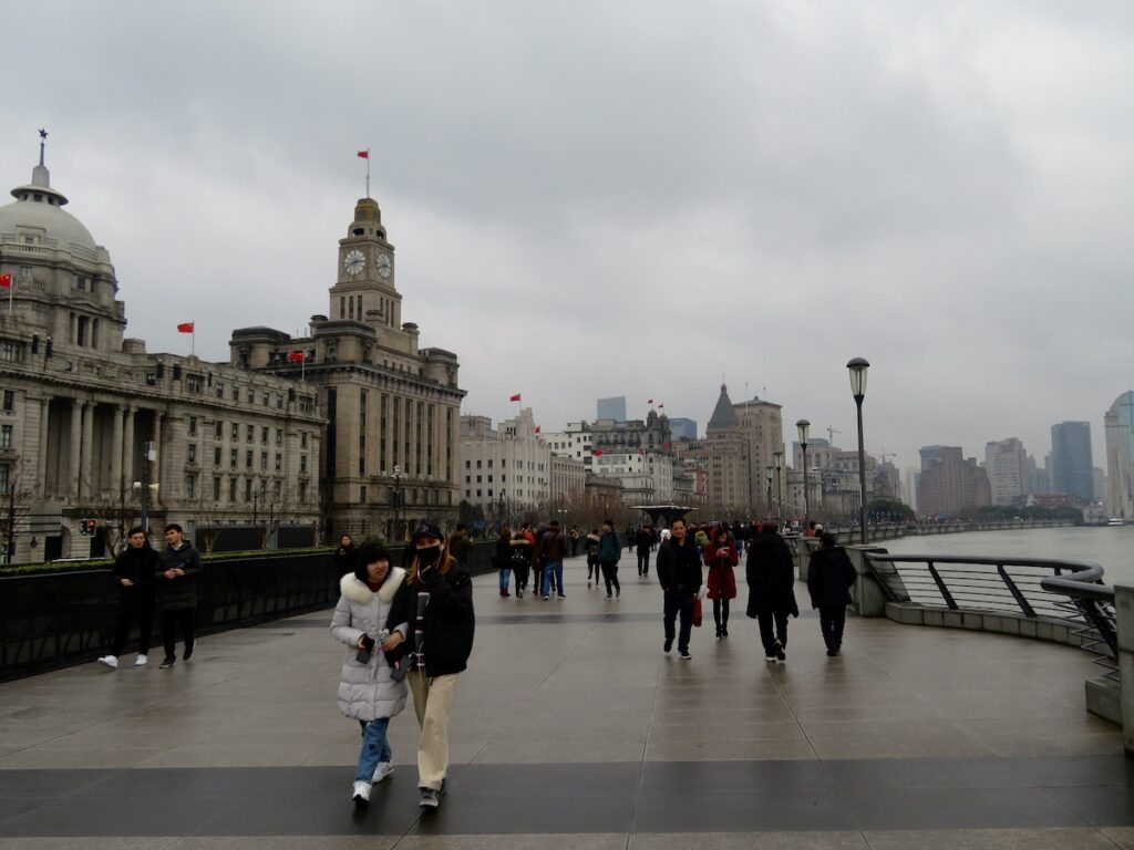 People walk along the Bund in Shanghai, China