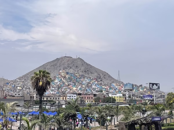 A mountain with colorful, poor buildings in Lima