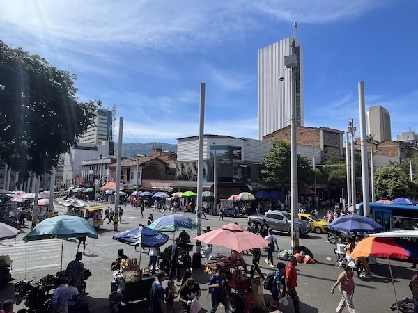 Street vendors under umbrellas in Latin America