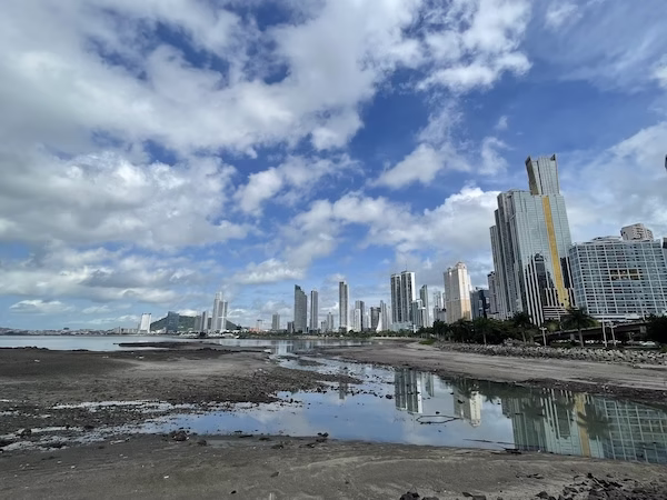 Low tide in front of high rise buildings in Panama City