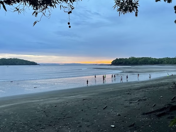 Kids playing soccer on a beach in Santa Catalina