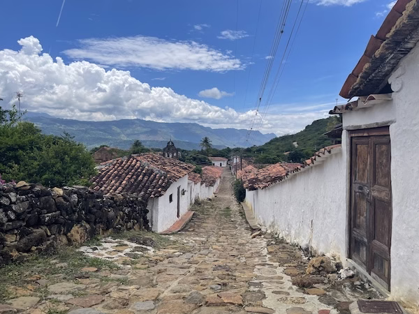 Cobblestone street and colonial buildings in Barichara, Colombia
