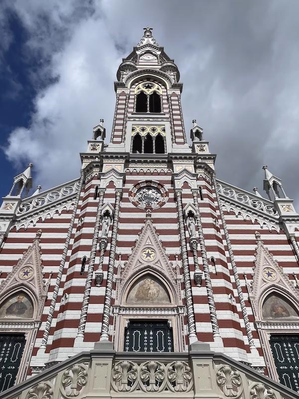 A red and white striped tower on a cathedral