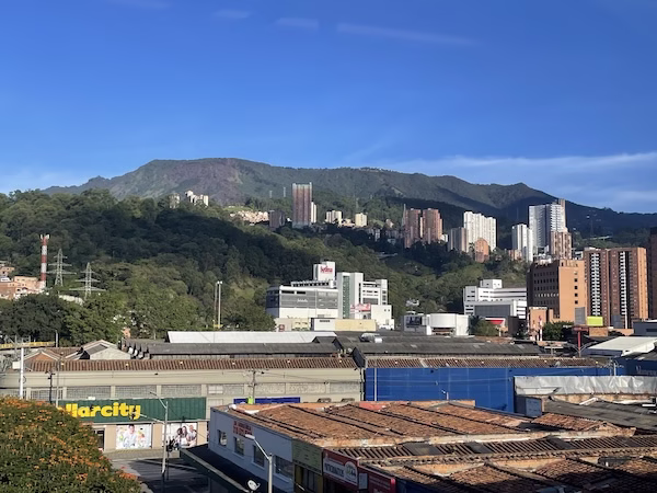 Tall buildings in front of a mountain in Medellin, Colombia