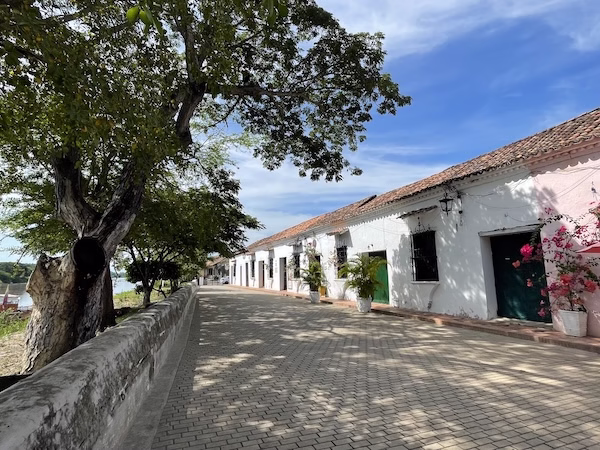 Colonial buildings and a cobblestone sidewalk in Mompox, Colombia