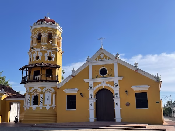 A bright yellow Spanish colonial style church