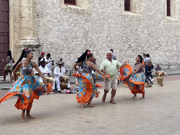 A local dance troop performs in a public square