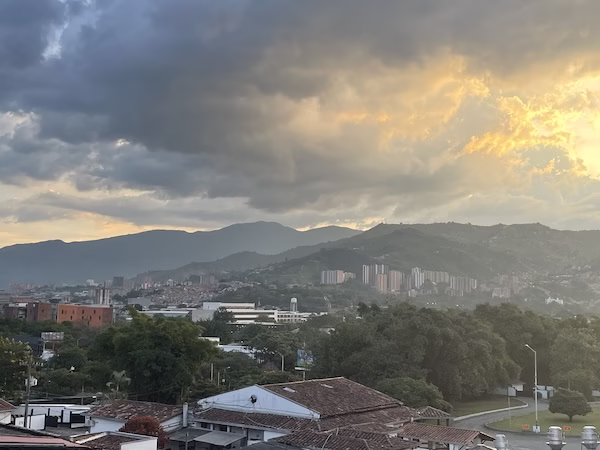 Sun setting behind the hills in Medellin, Colombia