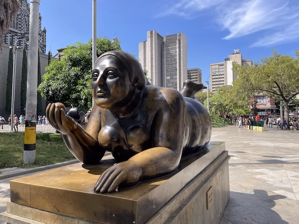 A bronze statue of a large woman by Fernando Botero in Plaza Botero