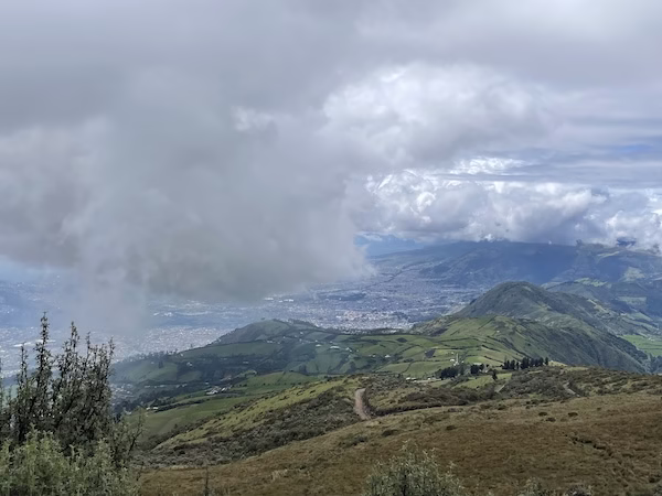 Cloudy skies over hills surrounding Quito