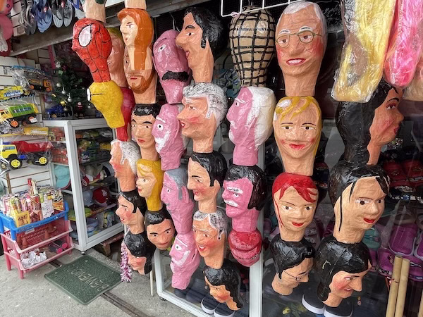 Paper mache masks on sale in Ecuador