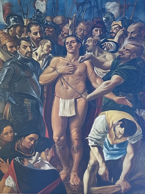 A painting of an indigenous man about to be burned at the stake, reminiscent of images of Christ being crucified.