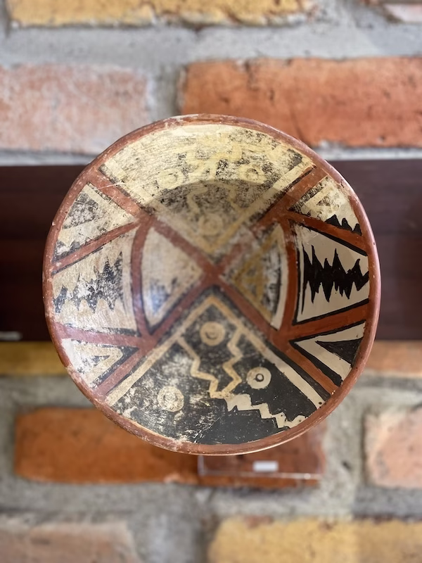 An ancient Inca plate painted in geometric patterns