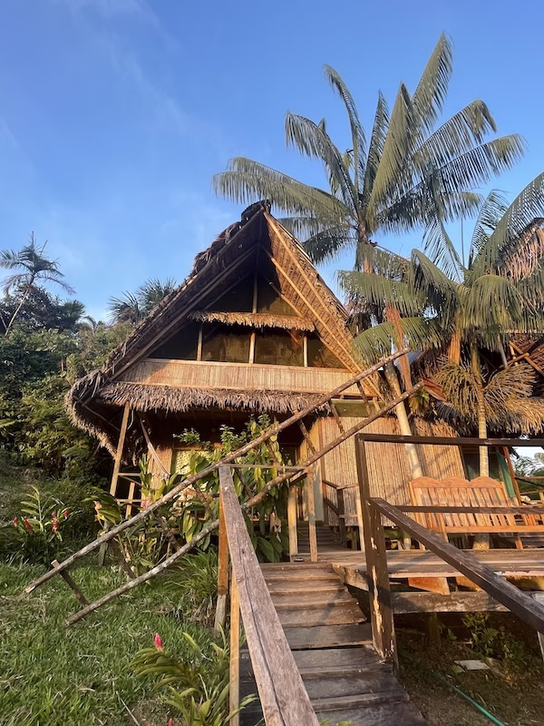 One of the wooden, thatch-roofed huts at the Reserva Natura Natural Park near Leticia in the Colombian Amazon