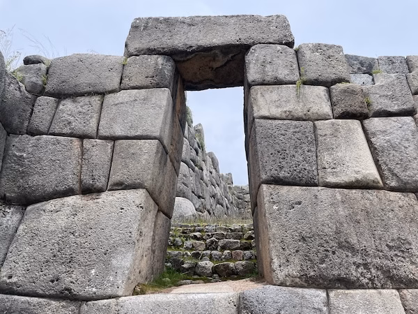 Inca stone wall and a doorway at a site near Cusco, Peru