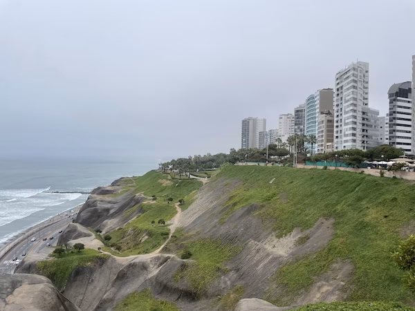 Buildings overlook the Pacific Ocean in the city of Lima