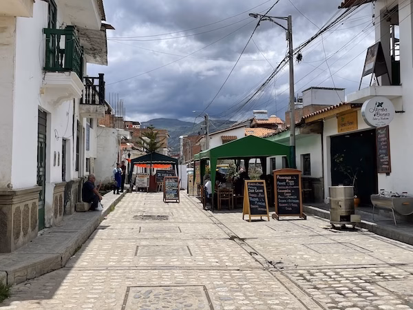 Restaurant signboards on a street in Huaraz, Peru