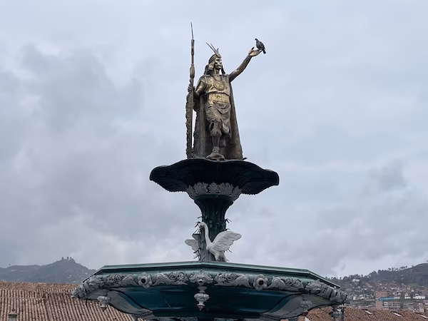 A statue of Inca emperor, Pachacuti on top of a fountain in the Plaza de Armas