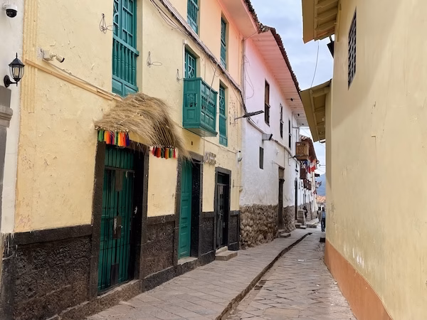 A narrow alley between buildings in central Cusco, Peru