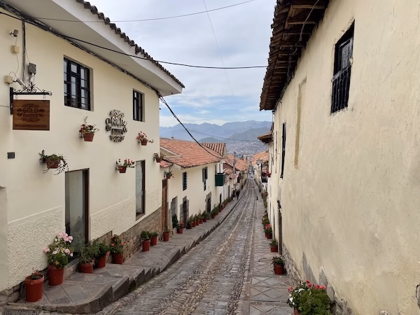 A narrow street between Spanish colonial buildings in Cusco