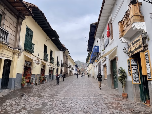 A street in Cusco lined with restaurants and souvenir shops