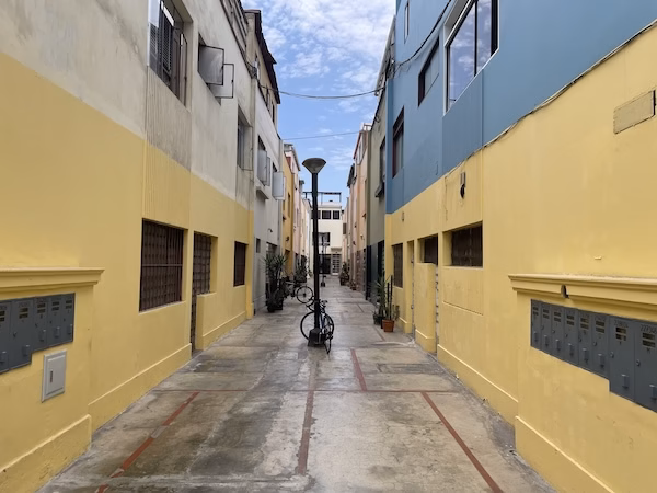 An alleyway between colorful buildings in Lima, Peru
