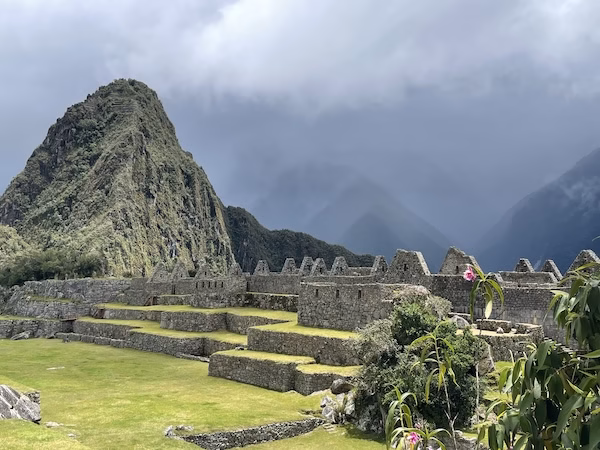 Clouds surround the ruins of ancient Inca buildings at Machu Picchu