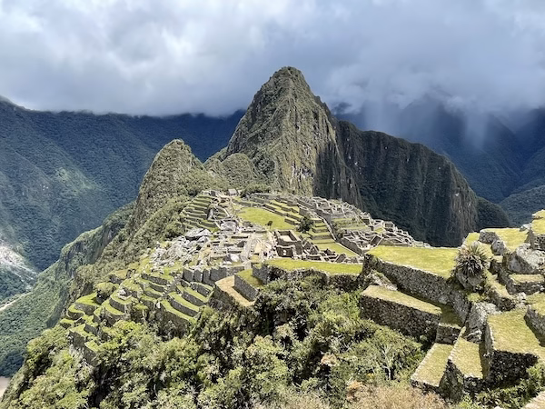 The classic view showing all of Machu Picchu surrounded by mountains and clouds
