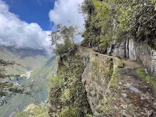 An ancient road overlooking a steep cliff outside of Machu Picchu