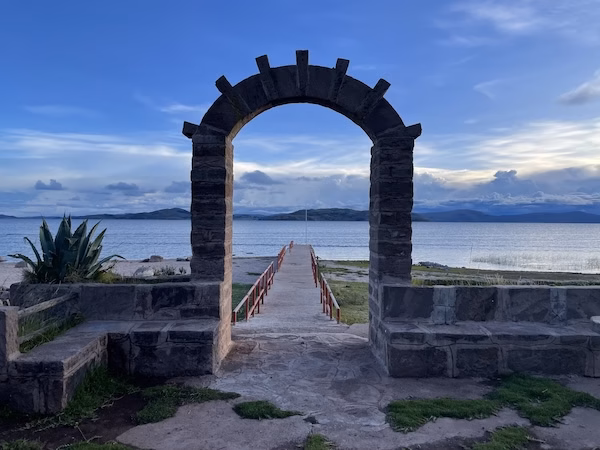 An archway overlooking a dock on Lake Titicaca