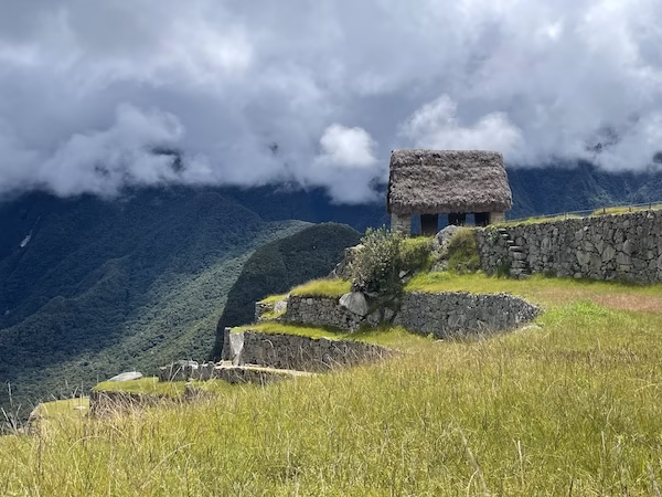 A thatch roofed hut near the ruins of Machu Picchu