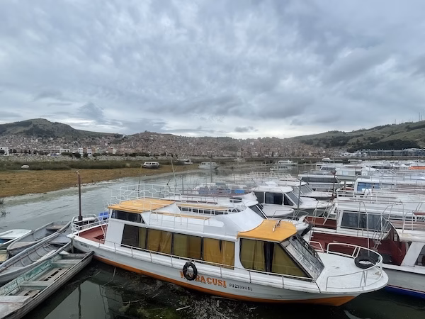 Small boats in front of Puno, Peru